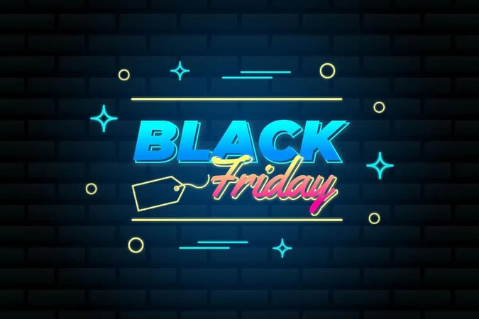  Letreiro em néon brilhante com o texto Black Friday em tons de azul e rosa sobre uma parede de tijolos pretos.